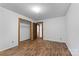 Simple bedroom with wood-look flooring and a closet at 3219 Mount Pleasant N Rd, Concord, NC 28025