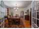 Bright dining room with hardwood floors and a view into the kitchen at 724 N Aspen St, Lincolnton, NC 28092