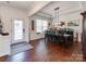 Formal dining room with hardwood floors and a bar area at 2701 Manor Stone Way, Indian Trail, NC 28079