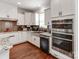 Modern kitchen with stainless steel appliances and granite countertops at 2701 Manor Stone Way, Indian Trail, NC 28079