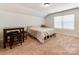 Upstairs bedroom with a bed and a small table and chairs at 2701 Manor Stone Way, Indian Trail, NC 28079