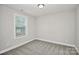 Simple bedroom with carpeted floor and window with blinds at 744 Wyoming Nw Dr, Concord, NC 28027