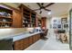 Home office with built-in shelves, a desk, and plenty of natural light at 1008 Medinah Ct, Waxhaw, NC 28173