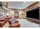 Home theater with luxurious leather seating and large projection screen at 1008 Medinah Ct, Waxhaw, NC 28173