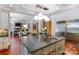 Open kitchen with island, stainless steel appliances, and views to Gathering room at 1008 Medinah Ct, Waxhaw, NC 28173