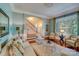 Elegant living room features hardwood floors, a cozy seating area, and a view of a grand staircase at 1008 Medinah Ct, Waxhaw, NC 28173