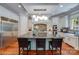 Gourmet kitchen features stainless steel appliances and a large island with seating at 1008 Medinah Ct, Waxhaw, NC 28173