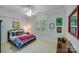 Cozy bedroom featuring a double bed, window shutters, and colorful wall art at 1008 Medinah Ct, Waxhaw, NC 28173