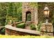 Landscaped walkway detail with stonework, greenery, and a light fixture at 1008 Medinah Ct, Waxhaw, NC 28173