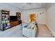 Bright media room with large TV, built-in shelving and comfortable seating at 1008 Medinah Ct, Waxhaw, NC 28173