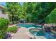 Luxury pool and spa with gazebo, surrounded by lush landscaping at 1008 Medinah Ct, Waxhaw, NC 28173