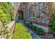 Landscaped walkway leading to a stone and brick home entrance at 1008 Medinah Ct, Waxhaw, NC 28173