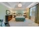 Large bedroom with a tranquil color scheme, plenty of light and built-in shelving at 1008 Medinah Ct, Waxhaw, NC 28173