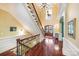 Impressive staircase with ornate railing and hardwood treads at 1008 Medinah Ct, Waxhaw, NC 28173