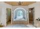 Luxurious bathroom with a large soaking tub, walk-in shower, and elegant fixtures at 1008 Medinah Ct, Waxhaw, NC 28173