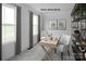Bright home office featuring built-in shelving and two comfortable chairs at 335 Maplestead St # 1112, Lancaster, SC 29720