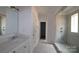 Bathroom with a walk-in shower, white vanity, and gray tile floor at 1120 Yellow Springs Dr, Huntersville, NC 28078