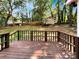 Wooden deck overlooks a fenced backyard with shed and mature trees at 2008 Sarn Ct, Gastonia, NC 28054