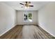 Main bedroom with ceiling fan and large window at 2008 Sarn Ct, Gastonia, NC 28054