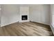 Living room with corner fireplace and light brown vinyl flooring at 2008 Sarn Ct, Gastonia, NC 28054