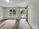 Living room with wood-look floors and access to the exterior at 2008 Sarn Ct, Gastonia, NC 28054