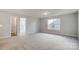 Spacious bedroom with carpet flooring and access to another room at 5312 Verona Rd # 74, Charlotte, NC 28213