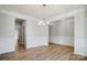 Bright dining room with chandelier and hardwood floors at 5312 Verona Rd # 74, Charlotte, NC 28213