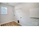 Laundry room with overhead shelving and window at 5312 Verona Rd # 74, Charlotte, NC 28213