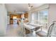 Bright kitchen with oak cabinets, white appliances, and dining area at 9720 Avensong Crossing Dr, Charlotte, NC 28215