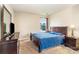 Spacious bedroom with a dark wood sleigh bed and dresser at 9720 Avensong Crossing Dr, Charlotte, NC 28215