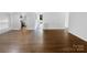Spacious living room with hardwood floors and kitchen view at 1819 Danbury St, Gastonia, NC 28052