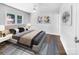 Bright bedroom with hardwood floors, double bed, and ceiling fan at 1819 Danbury St, Gastonia, NC 28052