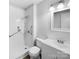 Updated bathroom with a walk-in shower and modern vanity at 1819 Danbury St, Gastonia, NC 28052