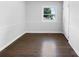 Bright bedroom with hardwood floors and a window with street view at 1819 Danbury St, Gastonia, NC 28052