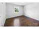 Bright bedroom with hardwood floors and wainscoting at 1819 Danbury St, Gastonia, NC 28052