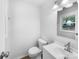 Clean bathroom, featuring a white vanity and updated fixtures at 1819 Danbury St, Gastonia, NC 28052