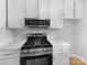 Modern kitchen with stainless steel appliances and white cabinets at 1819 Danbury St, Gastonia, NC 28052