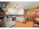 Kitchen with white cabinets and a view into the dining area at 1901 Davenport St, Newton, NC 28658