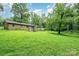 House with large backyard, green grass, and trees at 1901 Davenport St, Newton, NC 28658