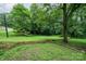 Spacious backyard with lush grass and wooded backdrop at 1901 Davenport St, Newton, NC 28658