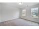 Bedroom with two windows, neutral walls and carpet at 106 Ballantree Rd # Lot 68, Mooresville, NC 28115