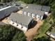 Aerial view of townhouses with gray roofs and red doors at 1008 Ribbon Ln, Charlotte, NC 28205