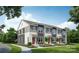 Three-unit townhouse building, showcasing a modern farmhouse exterior with gray siding and red doors at 1008 Ribbon Ln, Charlotte, NC 28205