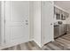 Bright entryway with white doors and hardwood floors at 1008 Ribbon Ln, Charlotte, NC 28205