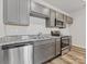 Modern kitchen with gray cabinets and granite countertops at 1008 Ribbon Ln, Charlotte, NC 28205