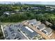 Aerial view of townhouses, parking, and surrounding neighborhood, highlighting the community's layout and landscaping at 1008 Ribbon Ln, Charlotte, NC 28205