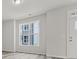 Bright and airy living area with large window and hardwood floors at 1008 Ribbon Ln, Charlotte, NC 28205