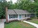 Newly renovated ranch home with gray siding and blue door at 526 Manchester Rd, Mount Gilead, NC 27306