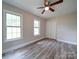 Bedroom with hardwood floors, ceiling fan, and double door closet at 526 Manchester Rd, Mount Gilead, NC 27306