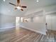 Open concept living room with kitchen view and hardwood floors at 526 Manchester Rd, Mount Gilead, NC 27306